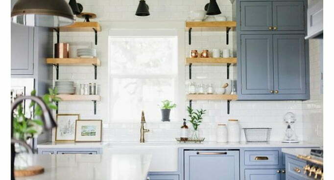 French country kitchen with black shelf brackets